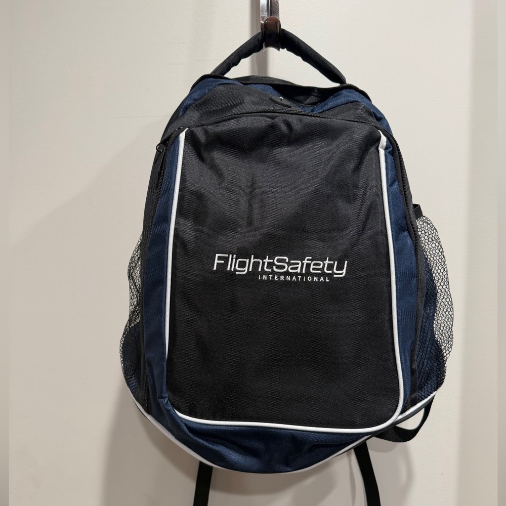 FlightSafety International Black & Navy Backpack. NWOT
